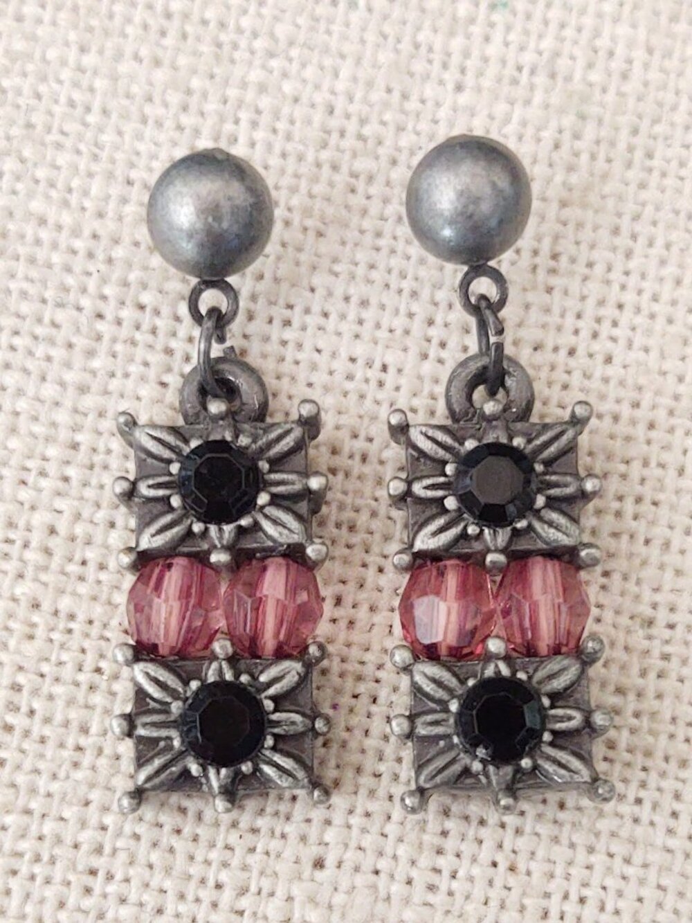 Silver dangle earrings with floral motif